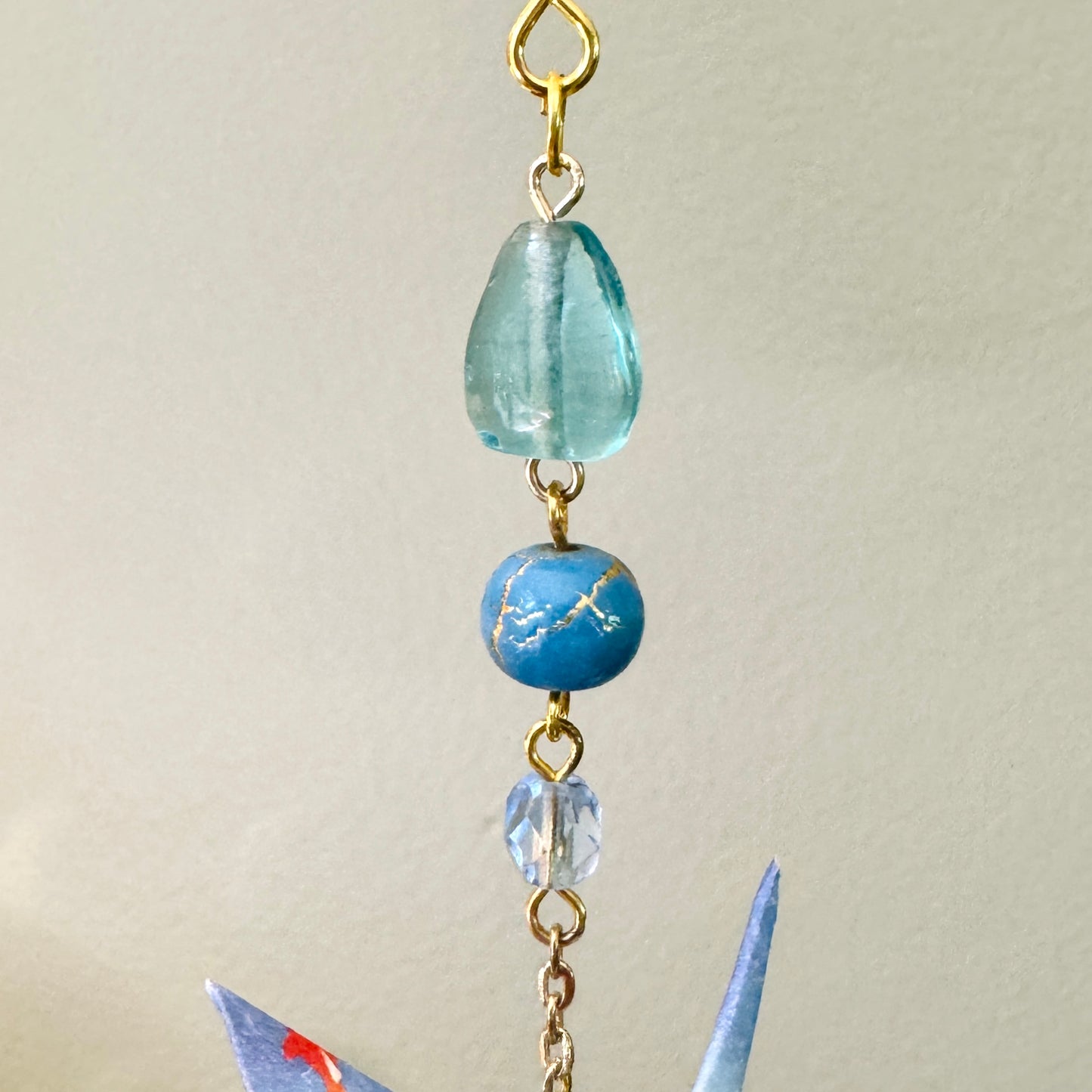 Origami Ornament #2145 - Small Crane with Enamel Fish Charm